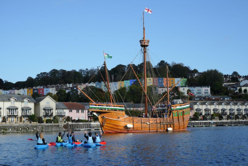 people on Kayaks waving at the matthew